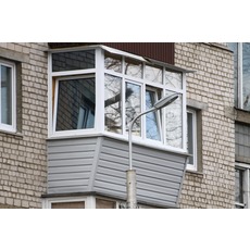 Обшивка балкона сайдингом в Киеве