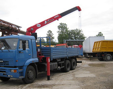 Аренда крана манипулятора перевезти бытовку негабарит Киев.